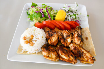 Chicken wings barbeque in a dish with BBQ grill sauce . Izgara tavuk kelebek sis kanat. Tavuk sis, gogus.