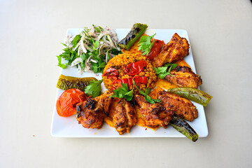 Chicken wings barbeque in a dish with BBQ grill sauce . Izgara tavuk kelebek sis kanat. Tavuk sis, gogus.