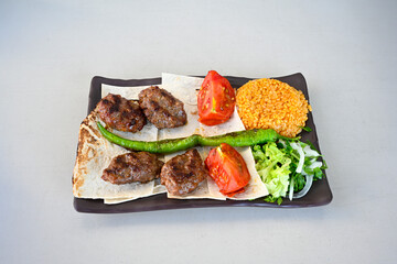 Meatball between bread (Turkish name : ekmek arasi kofte ) Izgara kofte. Manisa, Akcaabat, Akhisar  kofte. Delicious meat grilled meatballs.