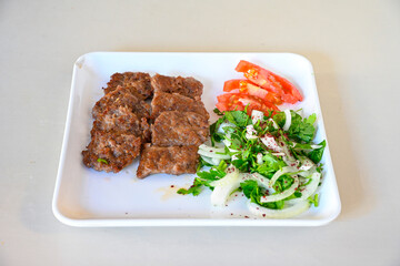 Meatball between bread (Turkish name : ekmek arasi kofte ) Izgara kofte. Manisa, Akcaabat, Akhisar  kofte. Delicious meat grilled meatballs.
