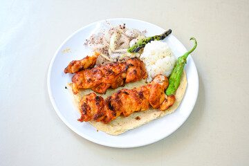 Chicken wings barbeque in a dish with BBQ grill sauce . Izgara tavuk kelebek sis kanat. Tavuk sis, gogus.