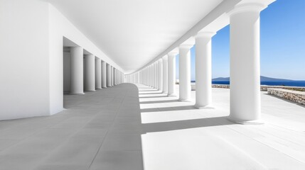 Obraz premium A long colonnade of white pillars creates a perspective leading towards a blue sea and sky
