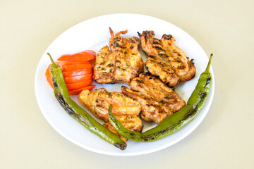 Chicken wings barbeque in a dish with BBQ grill sauce . Izgara tavuk kelebek sis kanat. Tavuk sis, gogus.