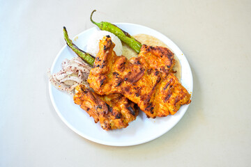Chicken wings barbeque in a dish with BBQ grill sauce . Izgara tavuk kelebek sis kanat. Tavuk sis, gogus.