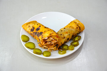 Lavash doner kebab ( soslu kasarli zurna doner durum )  or shawarma sliced in plate isolated. ...