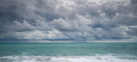 Windy waves crashing on a coast on a stormy day in winter.