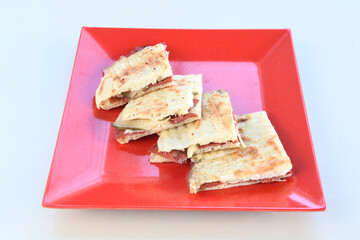 Turkish karisik atom kare  tost ( kasarli bazlama tost) . Sucuklu, Kasarli,  cheddarli, kavurmali karisik tost. Flat baked bread toasted. Karisik bazlama tost .