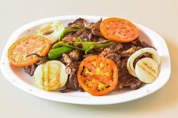Famous Urfa meat liver, ciger wrapped by lavash with roasted chili pepper, onion and sauce in Sanliurfa, Turkey. Kuzu et ciger sis. Izgara dana bonfile, cop sis, kuzu pirzola. Karisik kebap, beyti keb