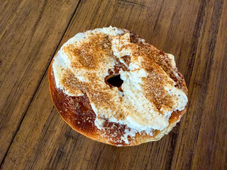 Half Toasted Bagel With Cream Cheese And Gingerbread Sugar Sprinkles