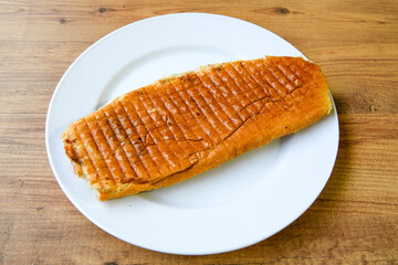 Turkish karisik atom kare  tost ( kasarli bazlama tost) . Sucuklu, Kasarli,  cheddarli, kavurmali karisik tost. Flat baked bread toasted. Karisik bazlama tost .