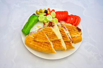 Turkish karisik atom kare  tost ( kasarli bazlama tost) . Sucuklu, Kasarli,  cheddarli, kavurmali karisik tost. Flat baked bread toasted. Karisik bazlama tost .