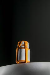 orange acrylic pours out of the bottle, acrylic for painting on canvas