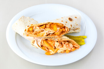 Lavash doner kebab ( soslu kasarli zurna doner durum )  or shawarma sliced in plate isolated.  Tavuk Et Doner Durum. Hatay Iskenderun usulu bazuka, zurna  tavuk doner durum. 