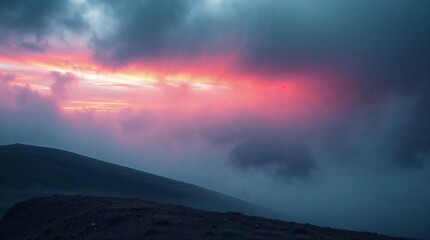 Obraz premium Red sunrise / sunset over a hill side