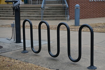 U-shaped bike rack next to bike repair station 