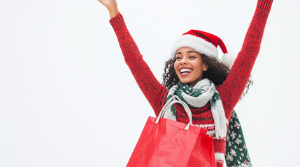 Obraz premium portrait of beautiful female wearing christmas sweater, santa hat and scarf, happy to the left both hands lifting red paper bag of christmas gifts, isolated on white background