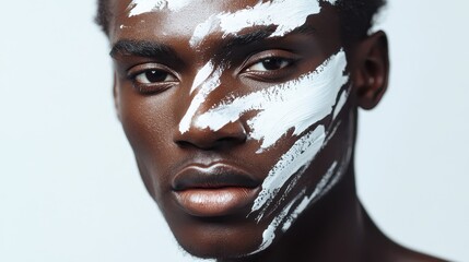 Portrait of Model with white paint strokes on his face