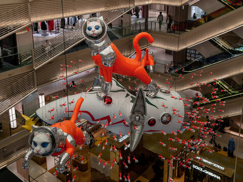 Tokyo, Japan - 18 November 2024: Japanese artist Kenji Yanobe&rsquo;s space themed astronaut cats hang in the central atrium at Ginza Six shopping mall in the popular district. Cats wearing space suits