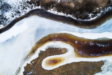 An aerial of an ice covering a river melting on an early spring day in Estonia, Northern Europe