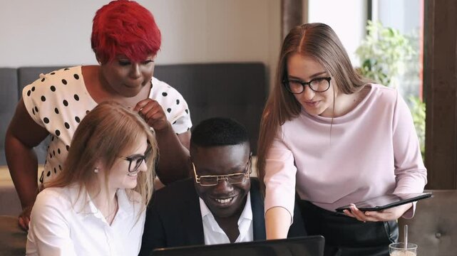 a group is working togeather on a project debating and sharing ideas