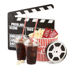 Tasty popcorn, film reel, clapper, soda drinks and movie tickets isolated on white
