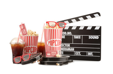 Tasty popcorn, glasses, film reels, soda drinks, clapper and movie ticket isolated on white