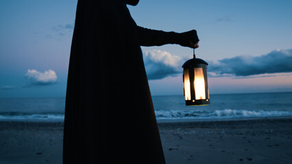Dark Dressed Man Holding The Lantern At The Sea  © francescosgura