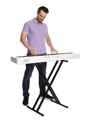 Bearded man playing synthesizer on white background