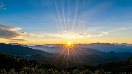Breathtaking sunrise rays illuminate mountain landscape and sky in natures beauty