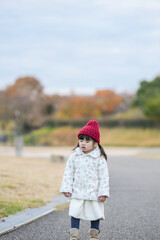 A 3-year-old Japanese girl is walking on a cold winter night in a seaside park in Hakata, Fukuoka Prefecture.