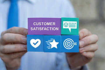 Person holding styrofoam blocks with icons sees inscription: CUSTOMER SATISFACTION. User give rating to service experience. Customer review satisfaction feedback survey concept.