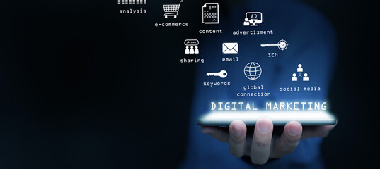 Digital marketing and advertising. A man using online advertisement and digital ad, many icons on virtual screen, using his tablet computer.