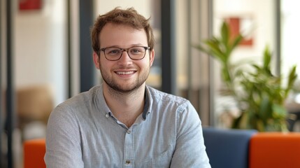 Handsome tech startup leader, showcasing innovation and confidence in a modern, casual office environment