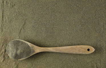 Dry chopped broccoli and wooden spoon, background and texture