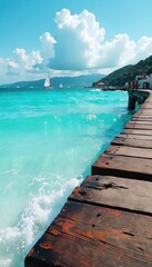 Obraz premium Turquoise ocean waves gently lapping against a weathered wooden dock, with sailboats and seagulls in the background , dock, sunny