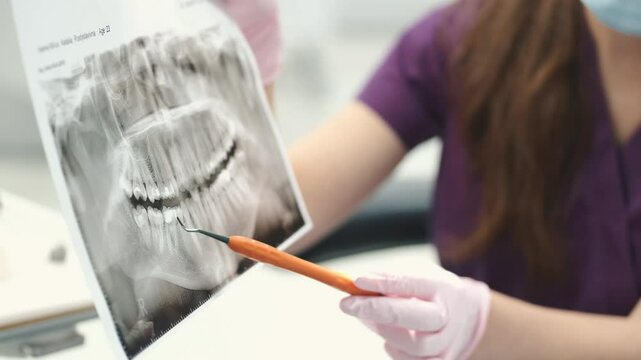 patent at the doctor office doing a routine check and fixing his teeth