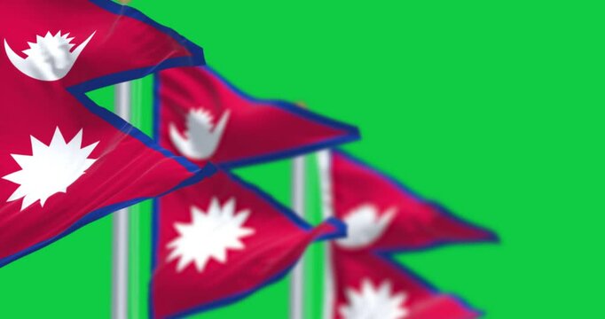 Close-up of Nepal National flag waving isolated on green background