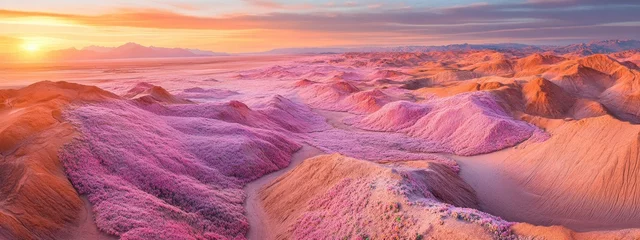 Fototapete A stunning landscape with vibrant pink hills under a colorful sunset. © MFajri
