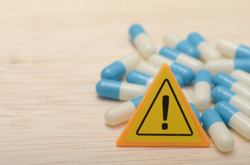 the warning triangle emphasizes the importance of following dosage instructions and seeking medical...