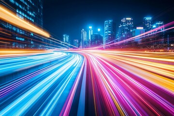 Fototapeta premium A vibrant cityscape at night with dynamic light trails from traffic.