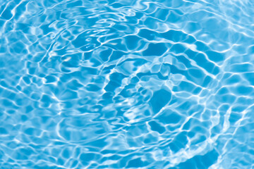 Blue water with ripples on the surface. Defocus blurred transparent blue colored clear calm water...
