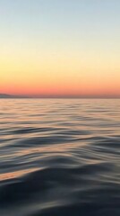 Fototapeta premium Serene Sunset Over Calm Ocean Waters