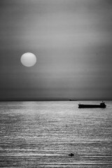 Strange sun over the sea