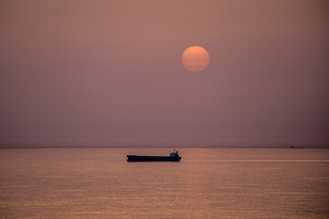 Boat and sunset in the sea