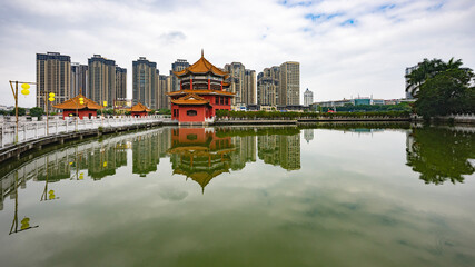 Buddhist temple with a bridge over the lake in Yunnan Province