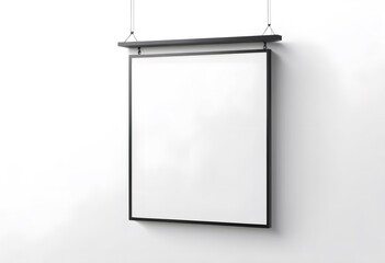 Blank square canvas hanging on white wall with black frame and shelf