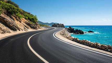 Winding asphalt road along the sea curving around a rocky mountain