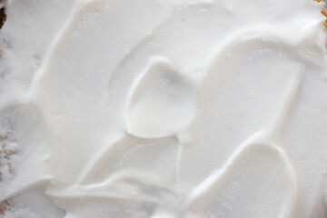 Sour cream, greek yogurt texture. White dairy product sample, creamy mousse closeup. Healthy natural food background