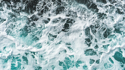 Foaming mixing ocean water blue deep colours close up background texture