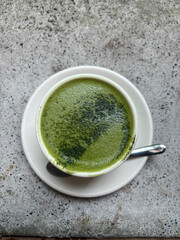 A cup of green tea latte.